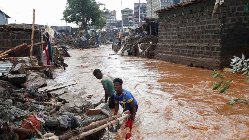 Residents recover their belongings after the Nairobi river burst its banks in the Mathare Valley settlement in Nairobi