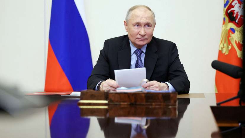 FILE PHOTO: Russian President Putin chairs a meeting with members of the Security Council via video link outside Moscow