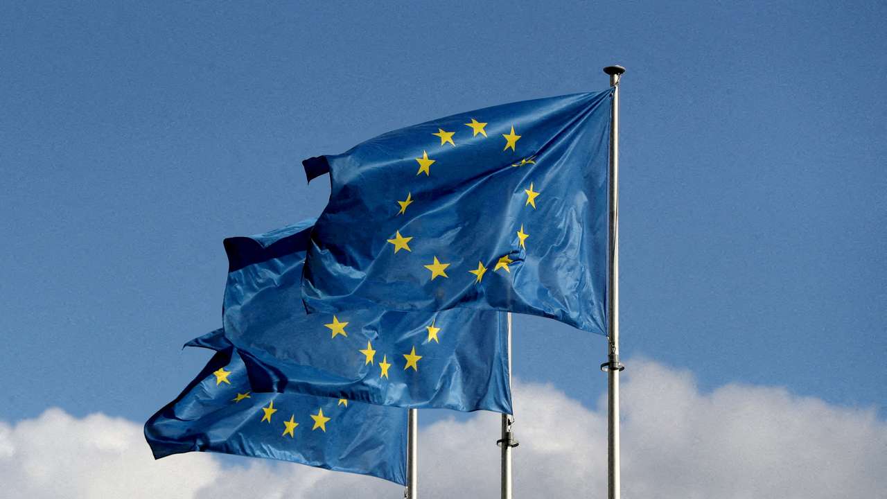 FILE PHOTO: European Union flags fly outside the EU Commission headquarters in Brussels