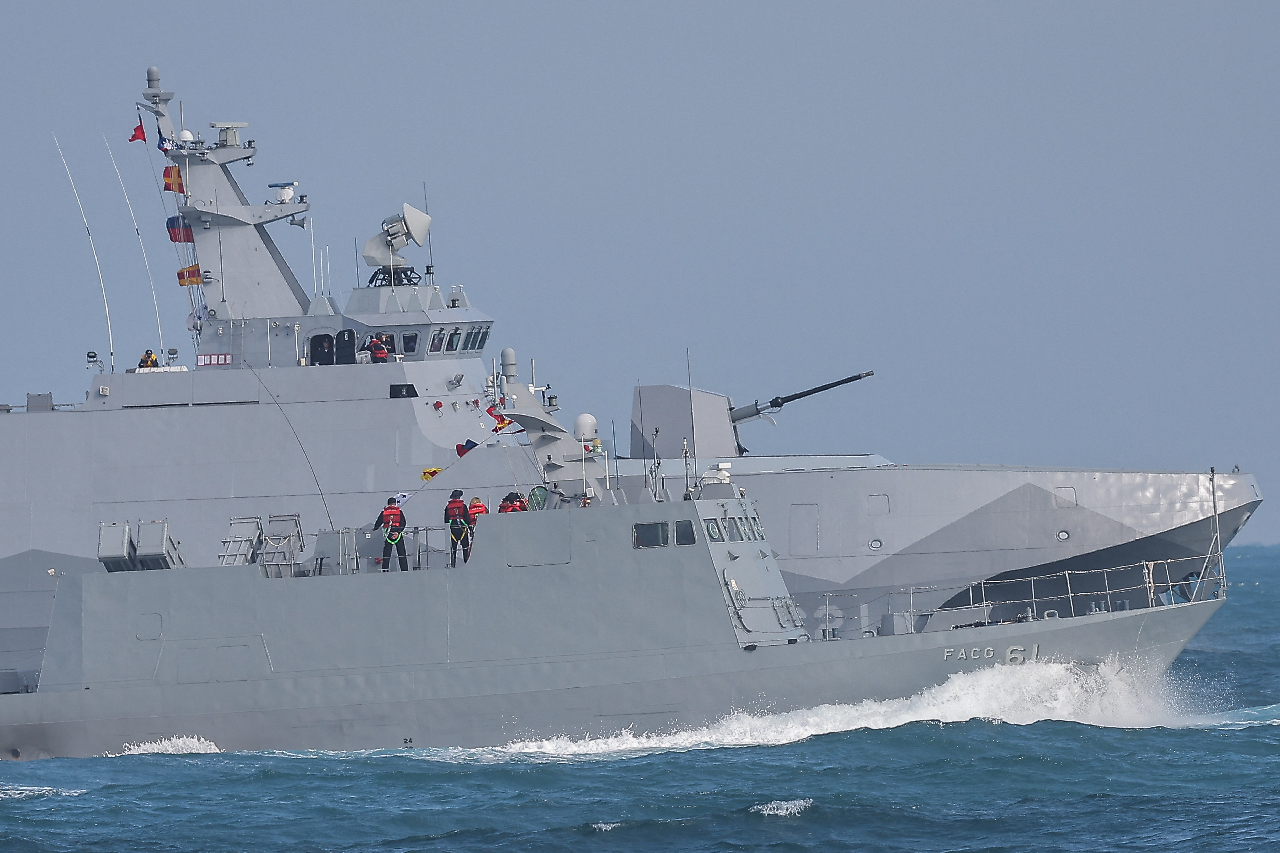 Navy personnel stand on board the Kuang Hua VI-class missile boat and Tuo Chiang-class corvette as the Taiwan military demonstrates combat readiness ahead of the upcoming Lunar New Year