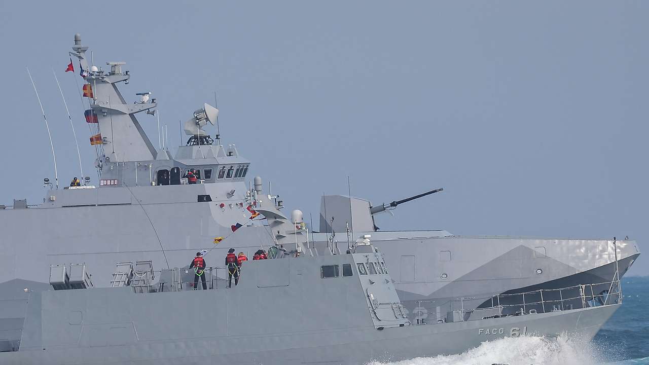 Navy personnel stand on board the Kuang Hua VI-class missile boat and Tuo Chiang-class corvette as the Taiwan military demonstrates combat readiness ahead of the upcoming Lunar New Year