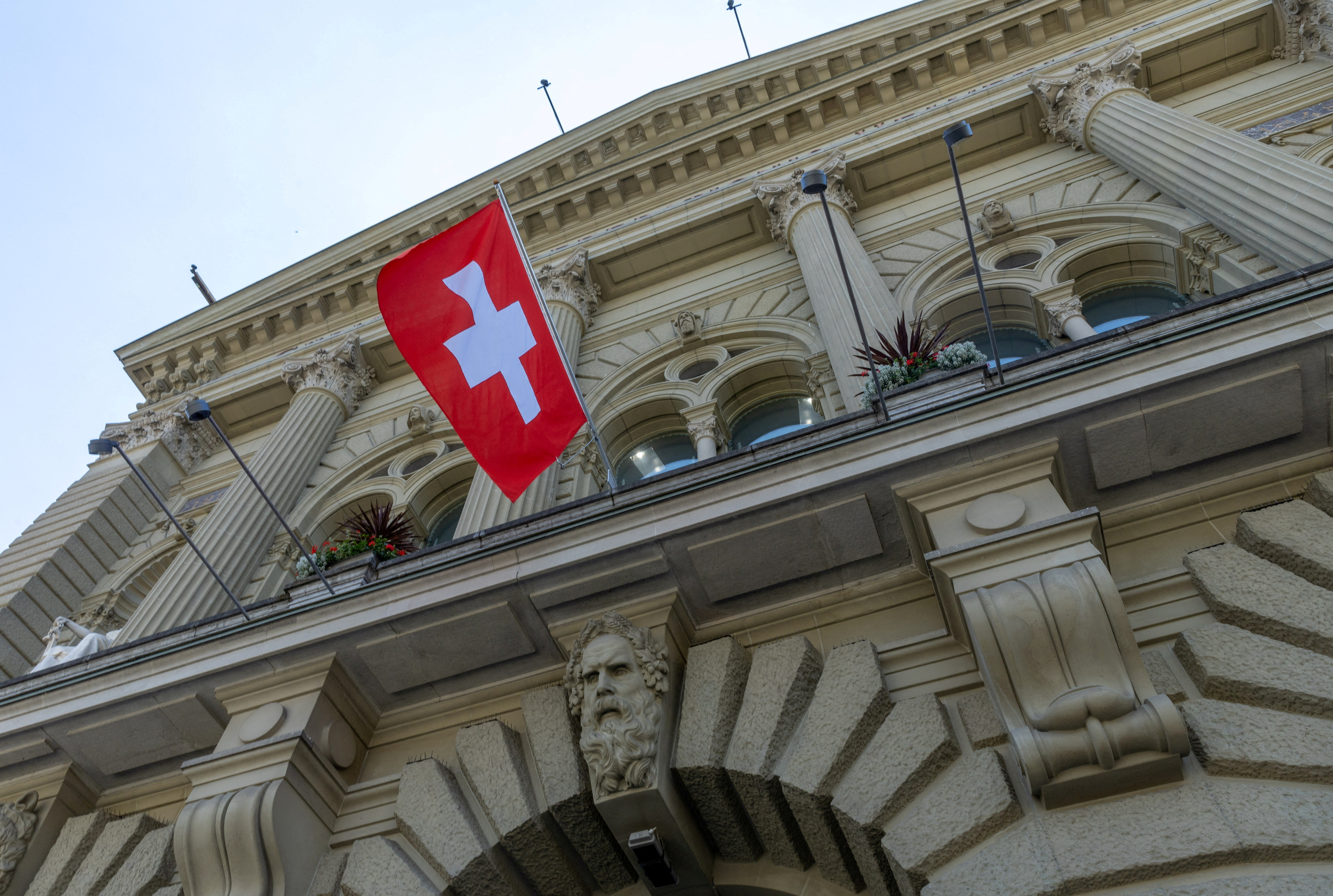 FILE PHOTO: The Swiss flag is seen on the Swiss Parliament house (Bundeshaus) in Bern
