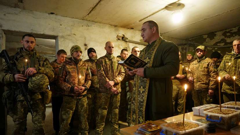 Ukrainian servicemen celebrate Christmas Eve in a front line in Donetsk region