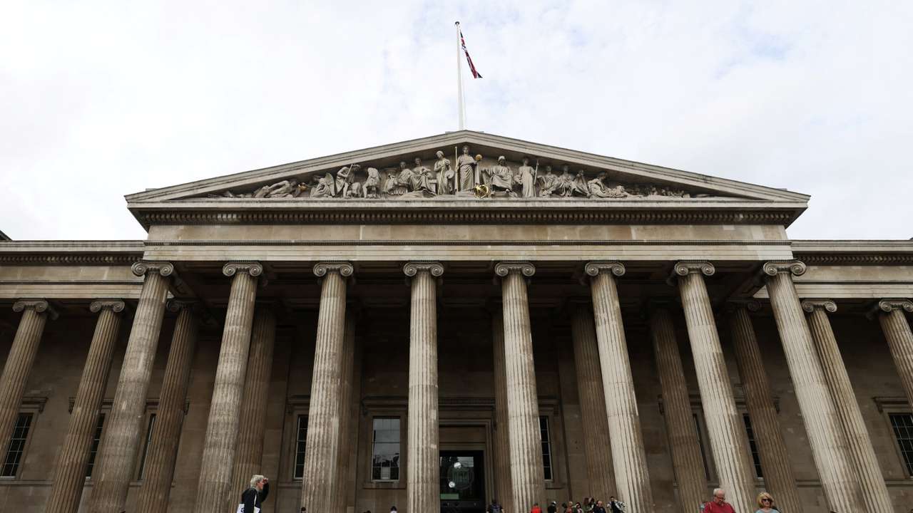 People walk in front of the British Museum in London