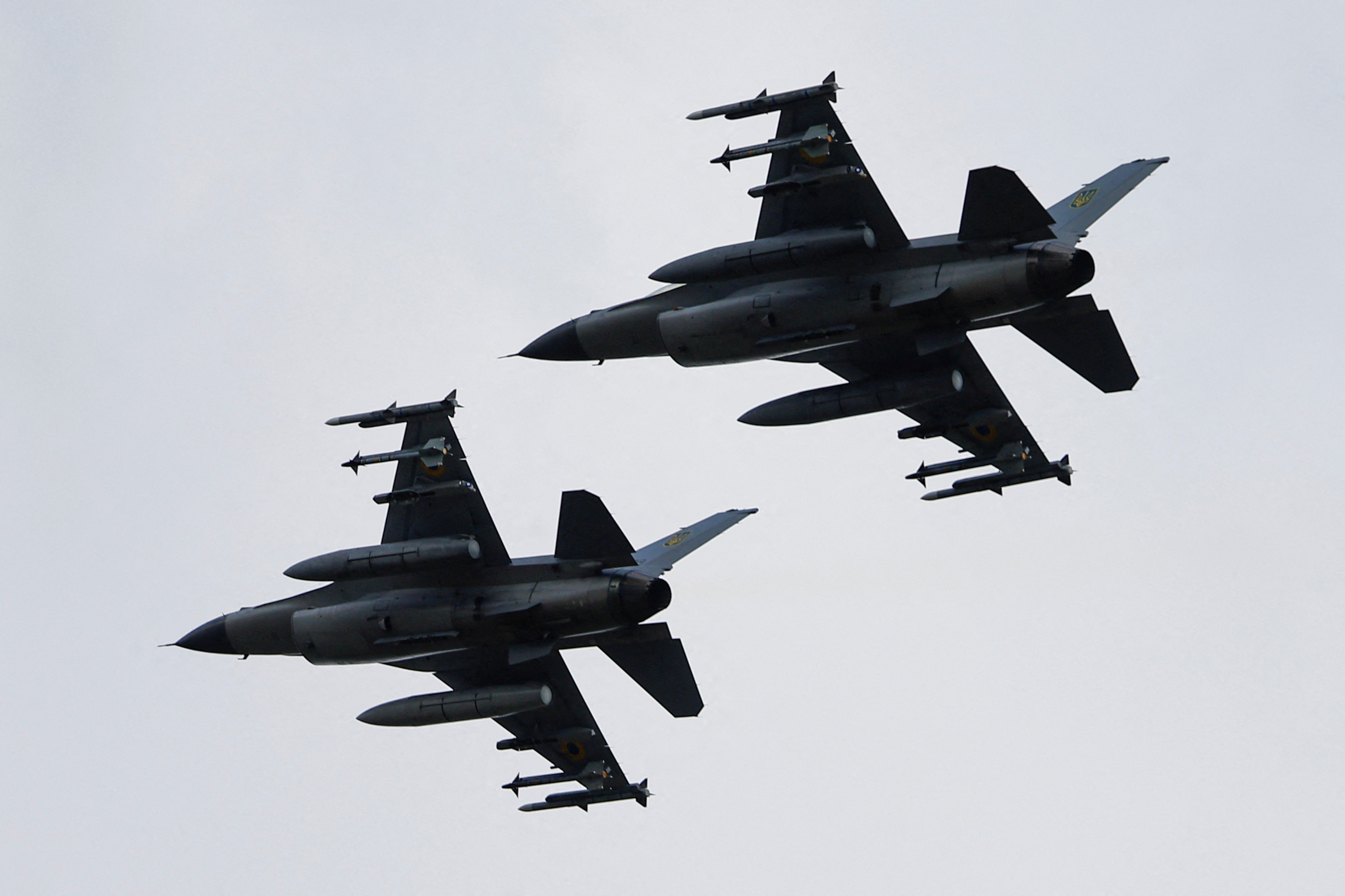 Ukrainian F-16 fighting aircrafts are seen in the air during marking the Day of the Ukrainian Air Forces in an undisclosed location in Ukraine