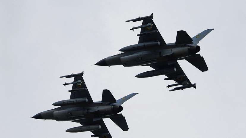 Ukrainian F-16 fighting aircrafts are seen in the air during marking the Day of the Ukrainian Air Forces in an undisclosed location in Ukraine