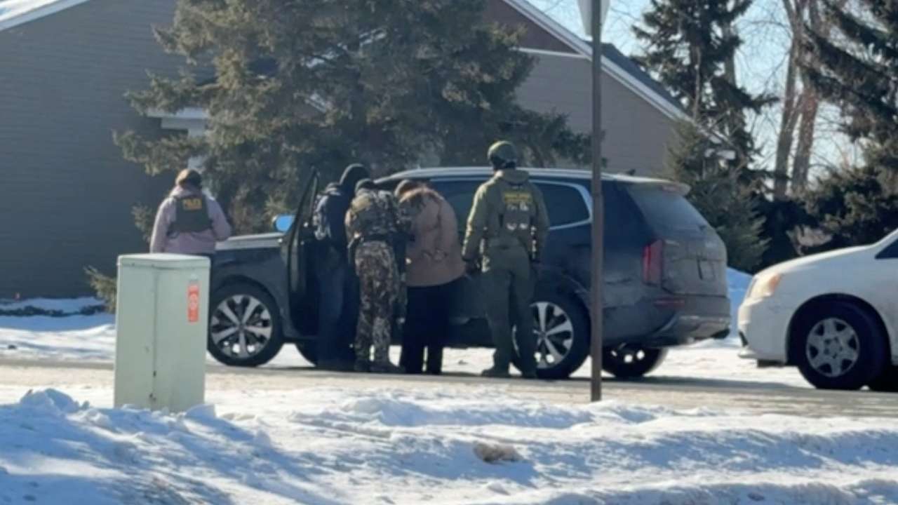 Rebecca Ringstrom is detained by federal immigration agents, as she observed an immigration enforcement operation in her neighborhood, in Blaine