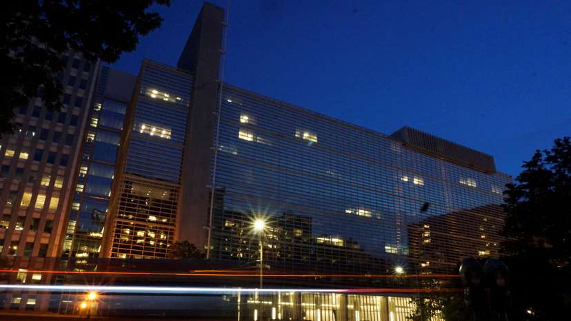 Vehicles pass in front of the World Bank building, which houses the International Centre for Settlement of Investment Disputes