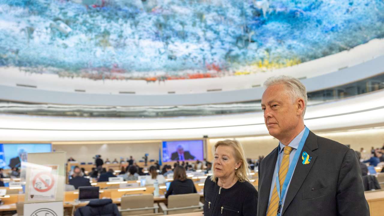 Britain's ambassador to the U.N. Manley walks out with other delegates during the speech of Vershinin, Deputy Minister of Foreign Affairs of Russia at the Human Rights Council in Geneva