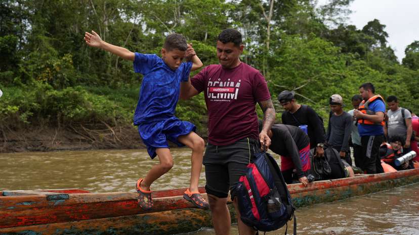 Migrants arrive to the migrant reception center, in Lajas Blancas