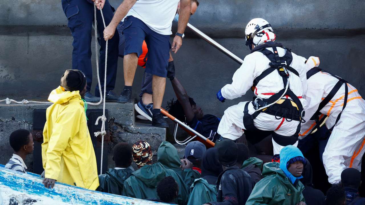 FILE PHOTO: Rescuers disembark a migrant in serious health condition at the port of La Restinga on the island of El Hierro