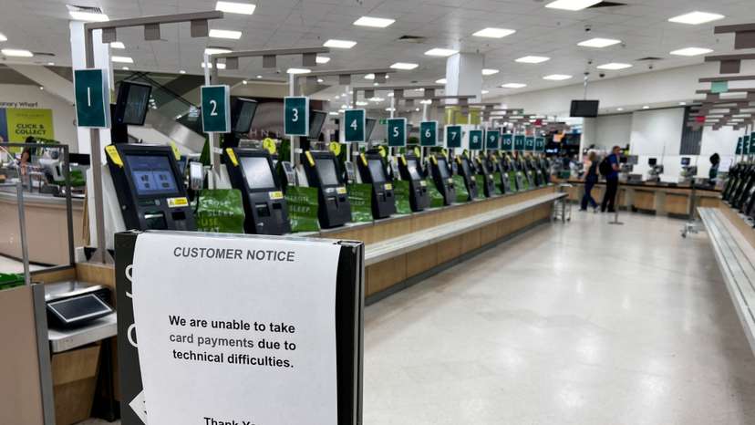 Technical difficulties notice is displayed, amid global IT outage, at supermarket in London