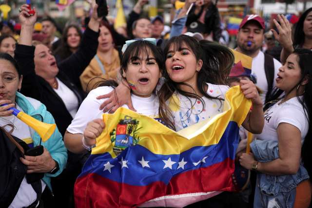 Venezuelans cast their vote to elect president, in Bogota