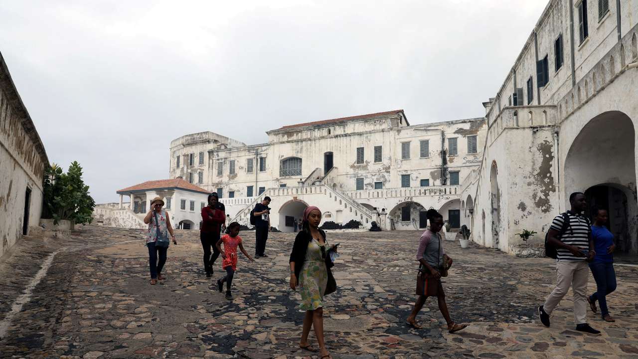 FILE PHOTO: Tourists are seen at the Cape Coast Castle one of several slave forts build on the Gold Coast off Cape Coast