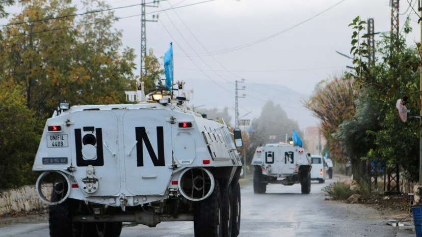 FILE PHOTO: UN peacekeepers (UNIFIL) vehicles ride along a street amid ongoing hostilities between Hezbollah and Israeli forces, in Marjayoun