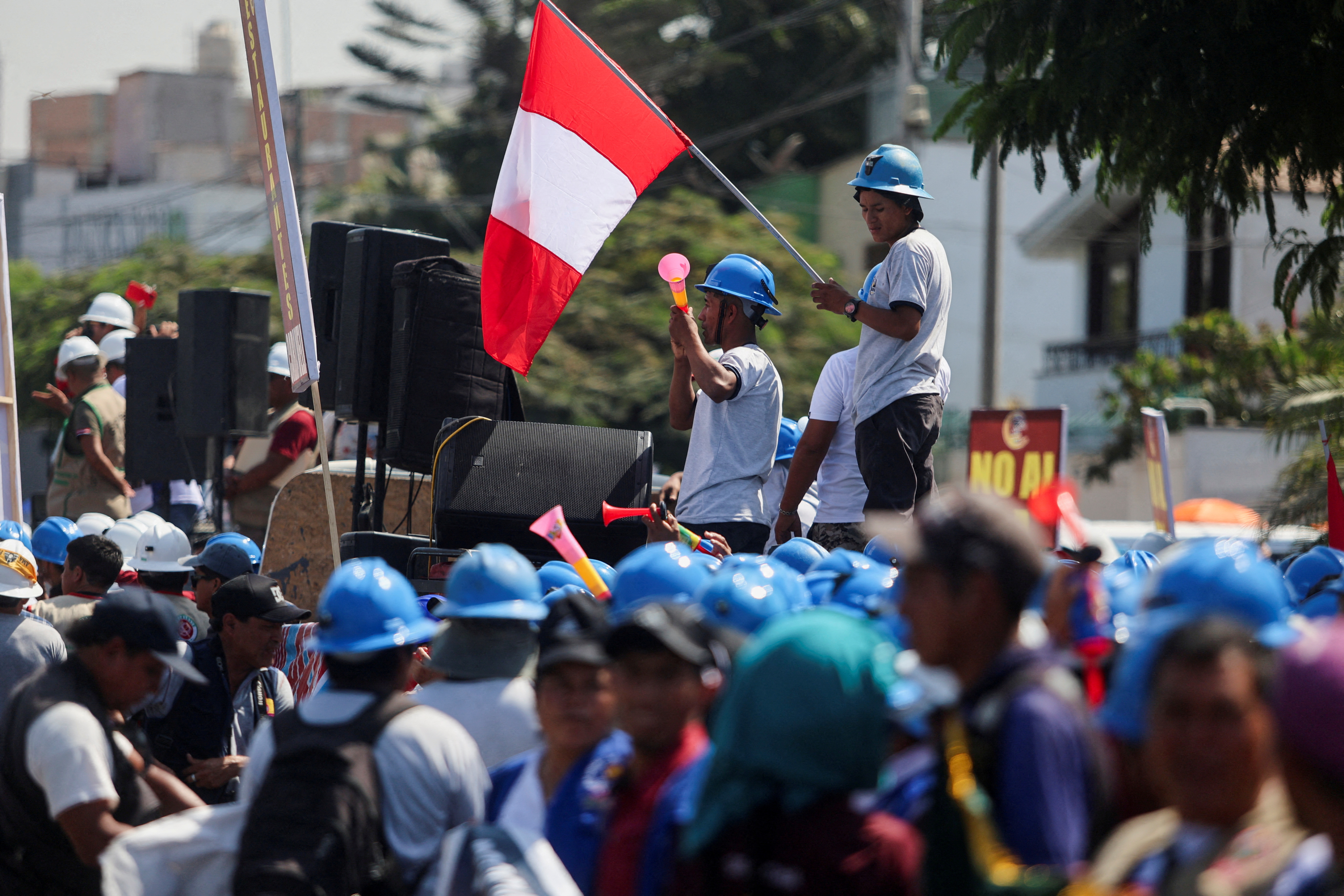 FILE PHOTO: Informal miners protest to demand the repeal of the law that prevents their formalization, in Lima