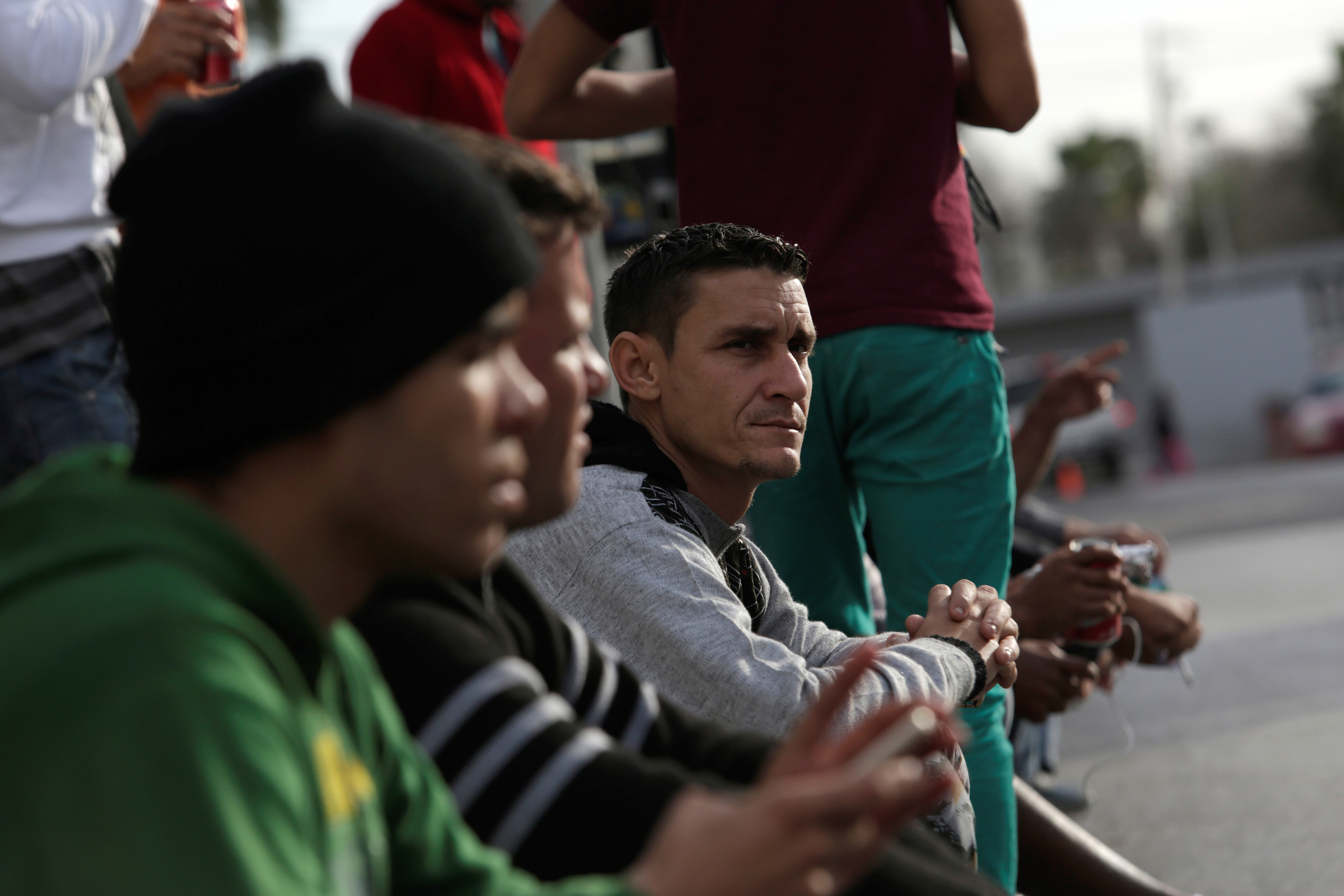 Cubans stranded in Mexico stand outside the border bridge after Washington repealed a measure granting automatic residency to virtually every Cuban who arrived in the United States, in Nuevo Laredo