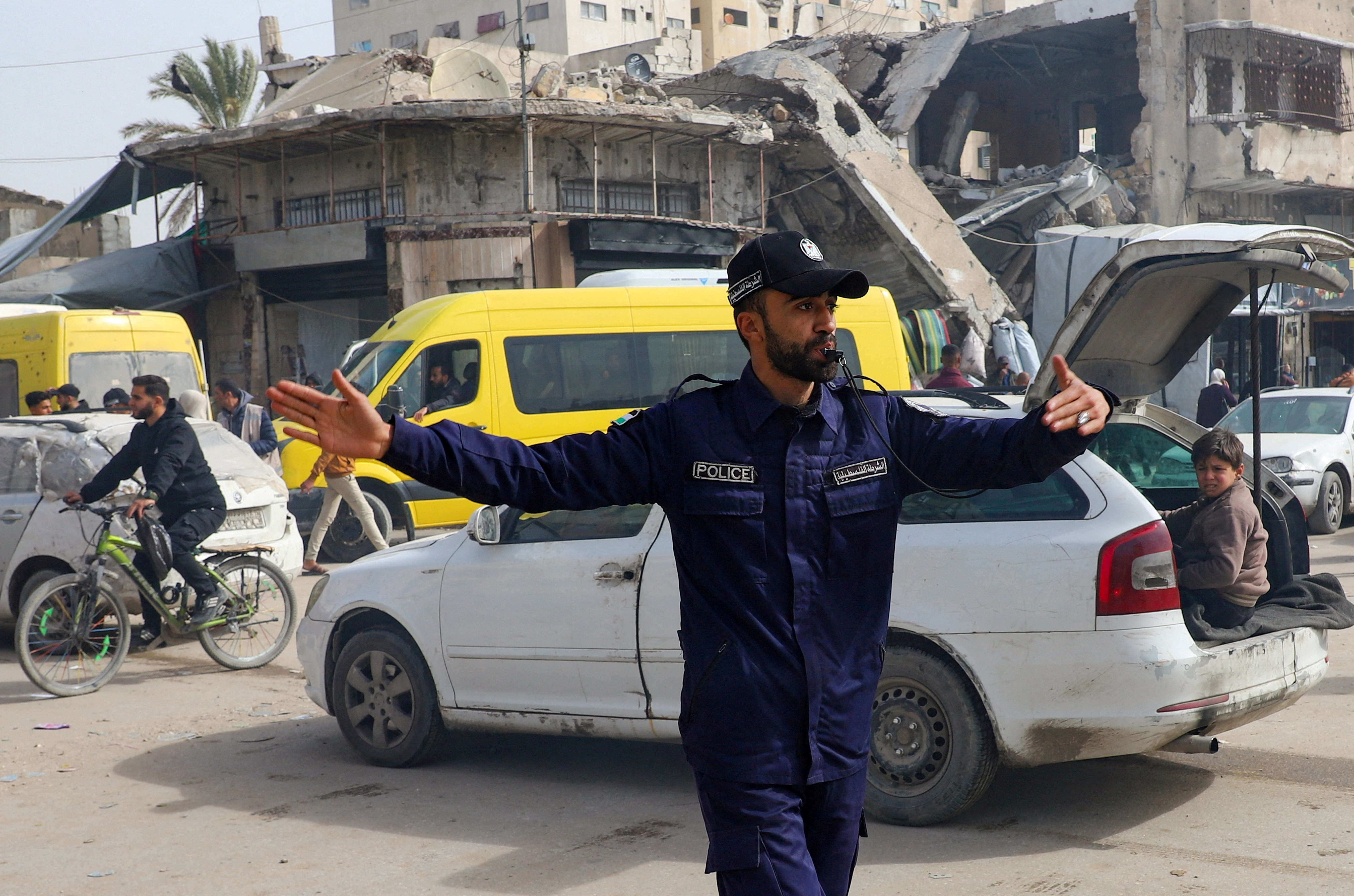 FILE PHOTO: Police officer from Hamas directs traffic in Gaza City