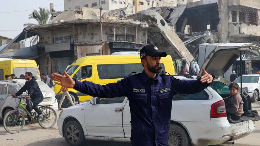 FILE PHOTO: Police officer from Hamas directs traffic in Gaza City