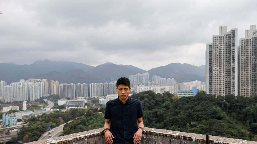 Pro-democracy activist Owen Chow reacts during an interview in Hong Kong