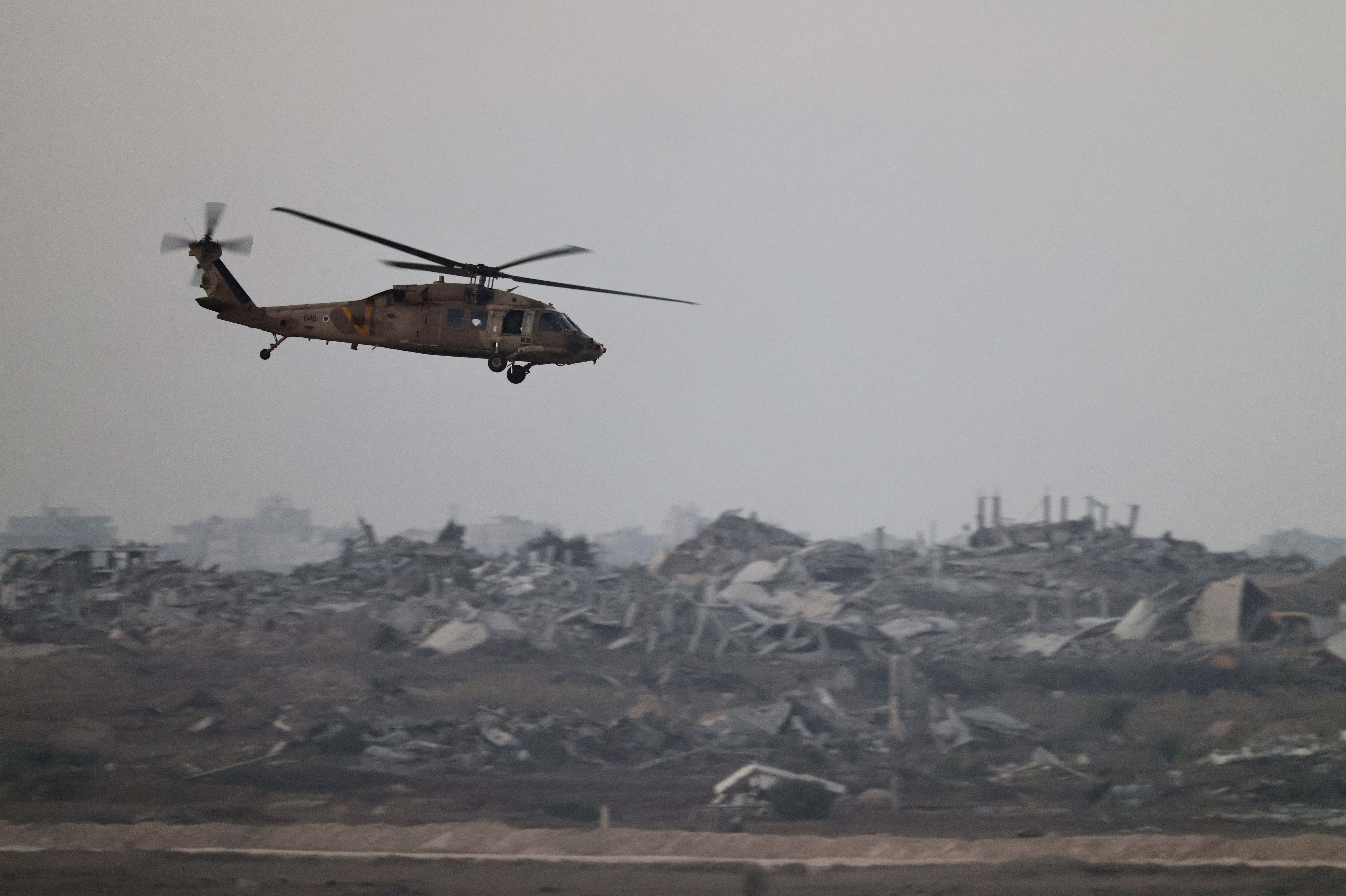 An Israeli Blackhawk evacuation helicopter flies over Gaza