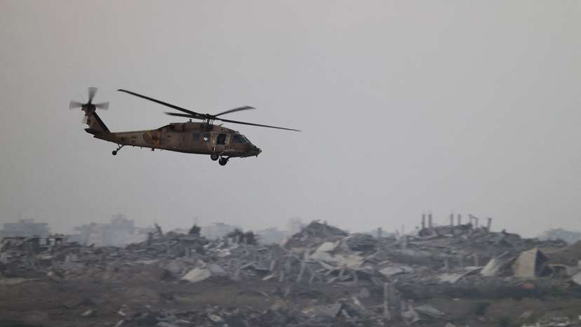 An Israeli Blackhawk evacuation helicopter flies over Gaza