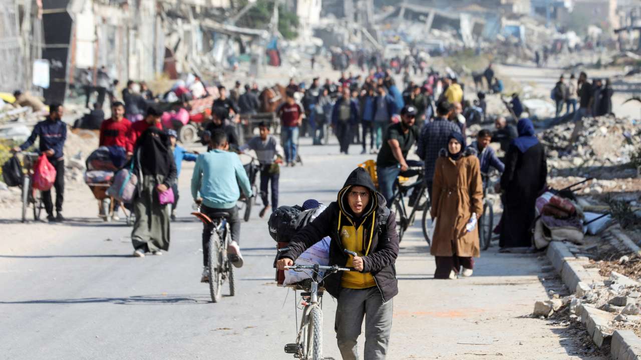 Displaced Palestinians flee the northern part of Gaza amid an Israeli military operation, in Gaza City