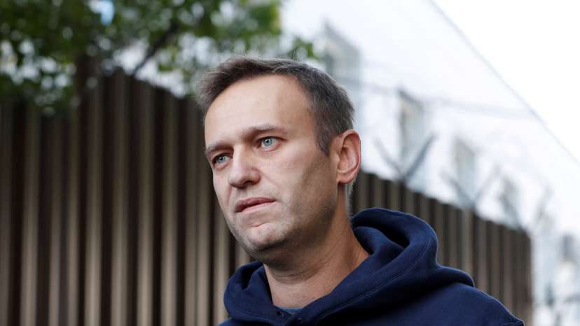 FILE PHOTO: Russian opposition leader Navalny speaks with journalists outside a detention centre in Moscow