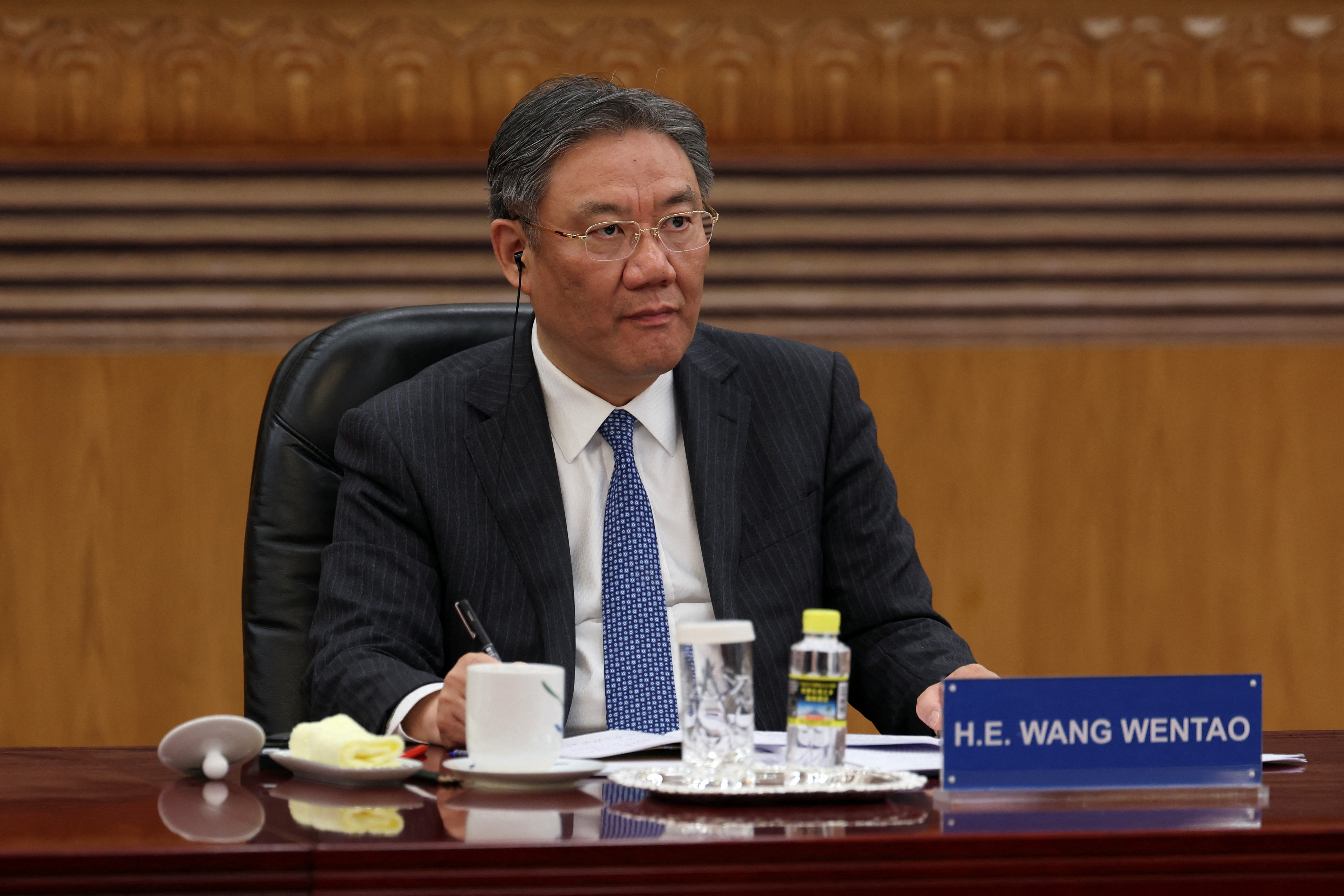 Chinese Commerce Minister Wang Wentao attends a meeting with foreign business leaders in Beijing