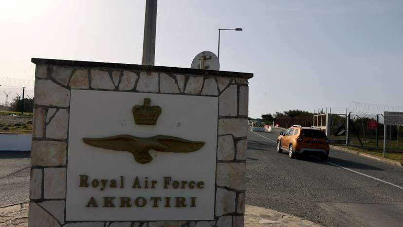 FILE PHOTO: A car drives in at the RAF Akrotiri, a British sovereign base in Cyprus that was hit by a drone early Monday, causing limited damage
