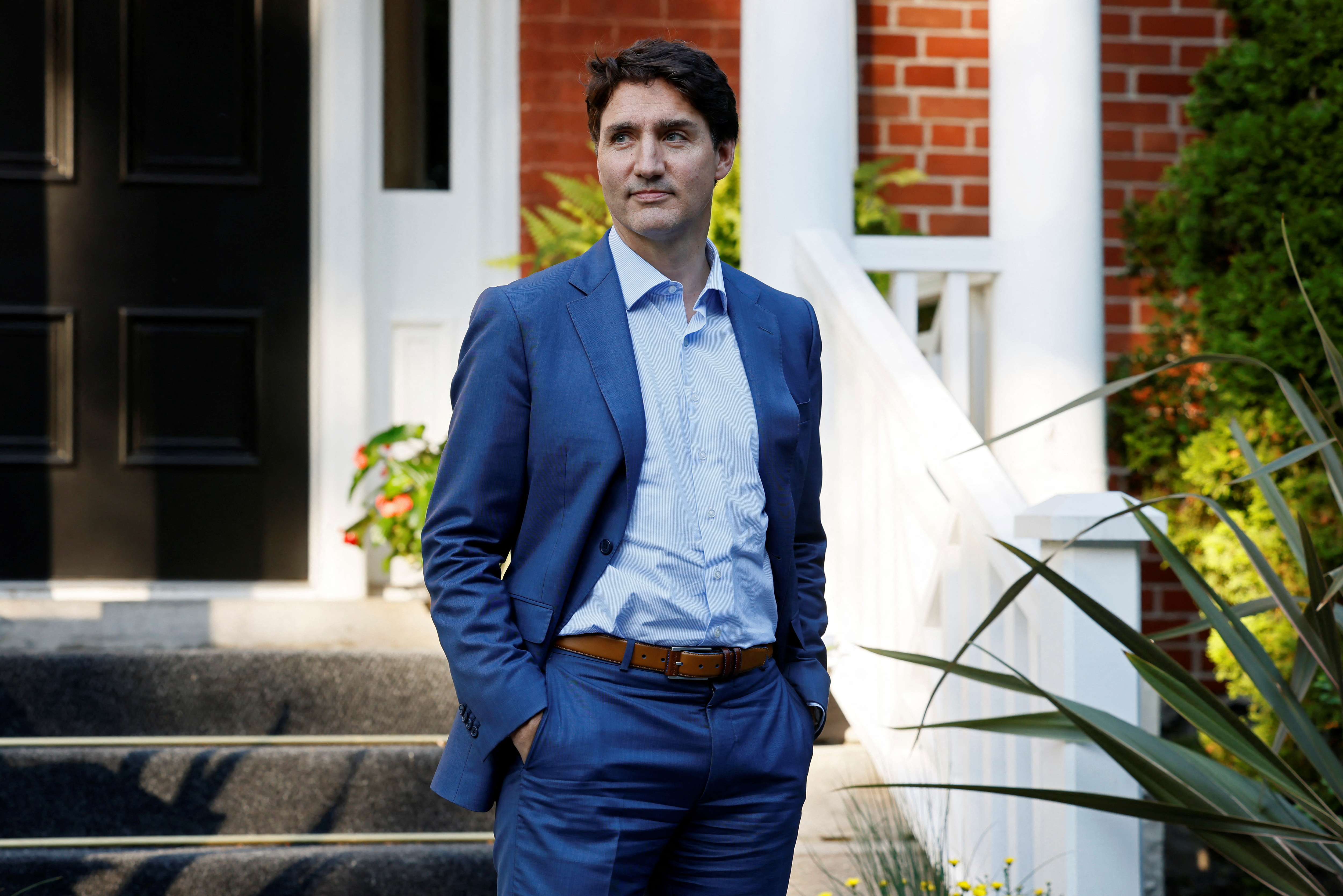 Canada's Prime Minister Justin Trudeau waits for the arrival of NATO Secretary-General Jens Stoltenberg at Rideau Cottage, Ottawa