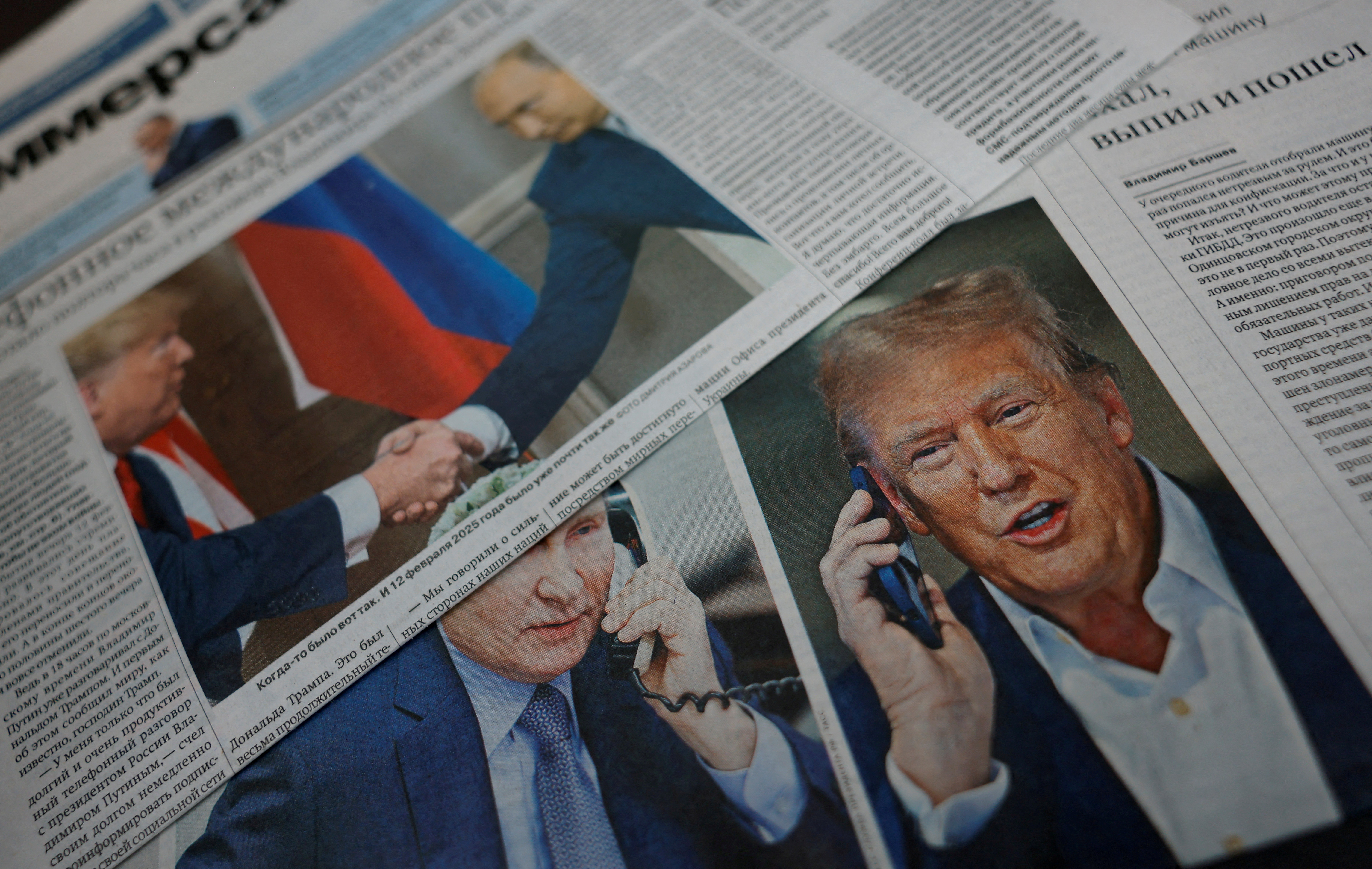 FILE PHOTO: View of newspaper covers dedicated to Putin-Trump phone call at newsstand in Moscow