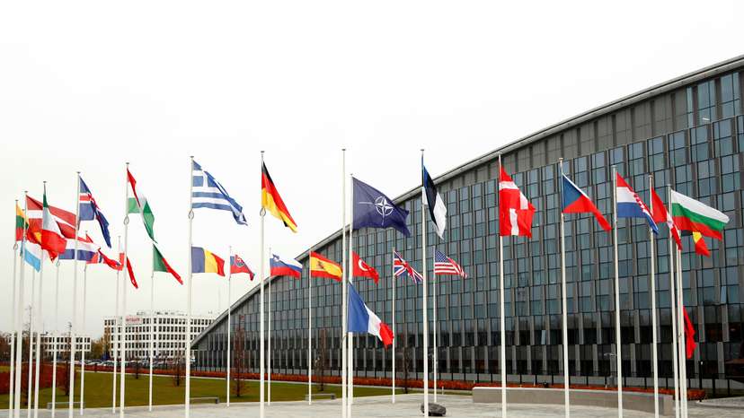 Flags of NATO member countries are seen at the Alliance headquarters in Brussels