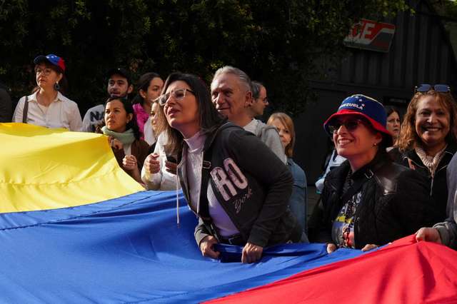 Venezuelans wait outside the consulate to vote on the day of Venezuela's presidential election, in Mexico City
