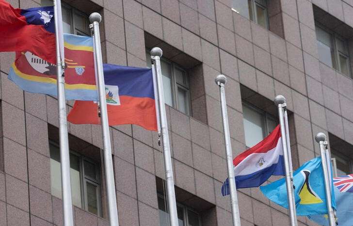 An empty flag pole where Nauru's flag used to fly is pictured next to flags of other countries at the Diplomatic Quarter which houses embassies in Taipei