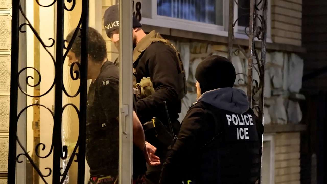 U.S. Immigration and Customs Enforcement (ICE) agents conduct an arrest in Chicago