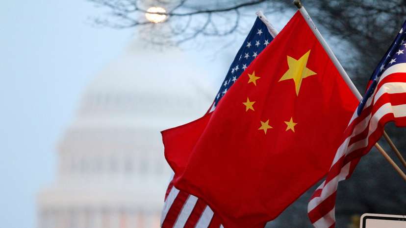 The People's Republic of China flag and the U.S. Stars and Stripes fly along Pennsylvania Avenue near the U.S. Capitol in Washington