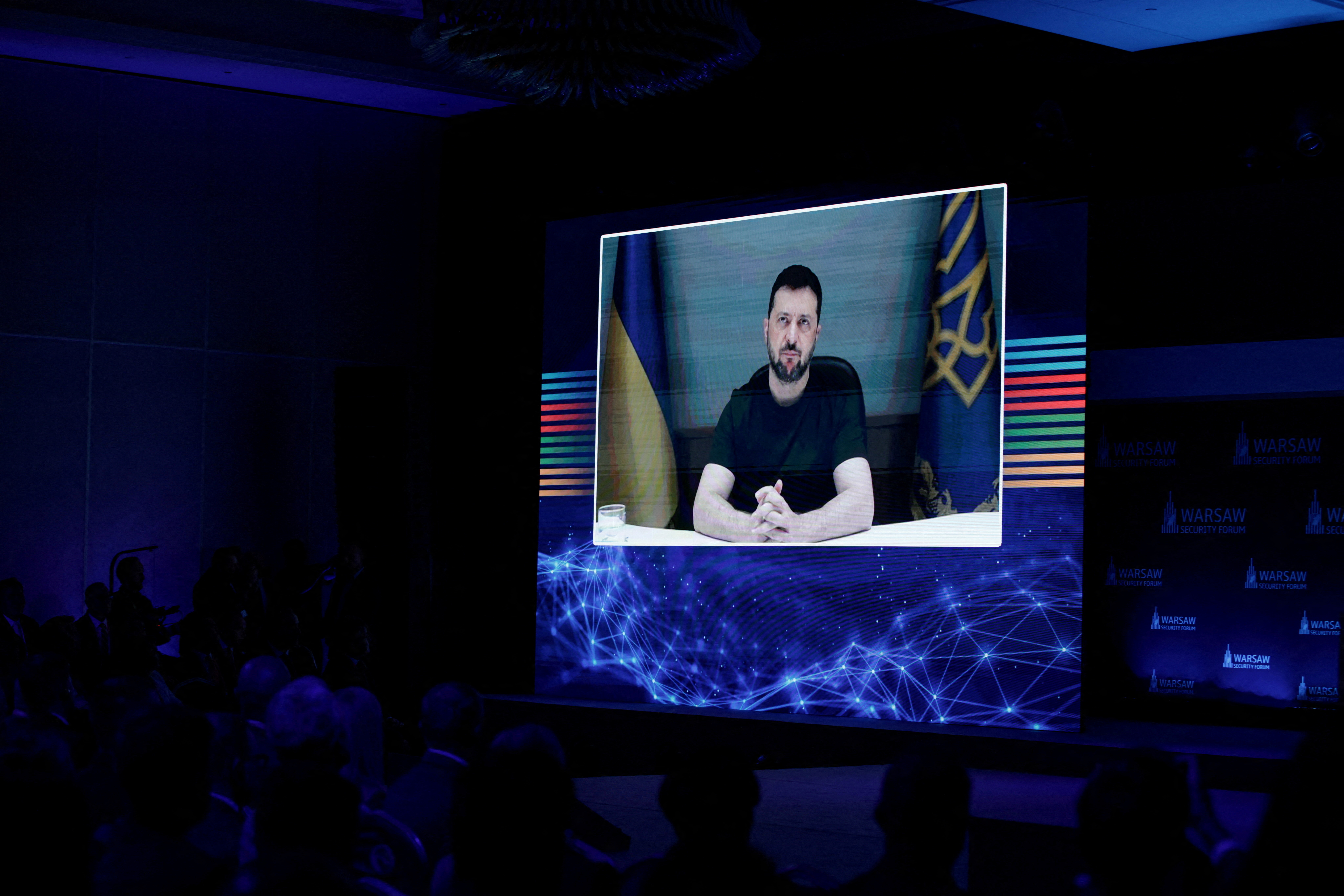 Ukraine's President Volodymyr Zelenskiy appears on-screen as he speaks during the Warsaw Security Forum, in Warsaw