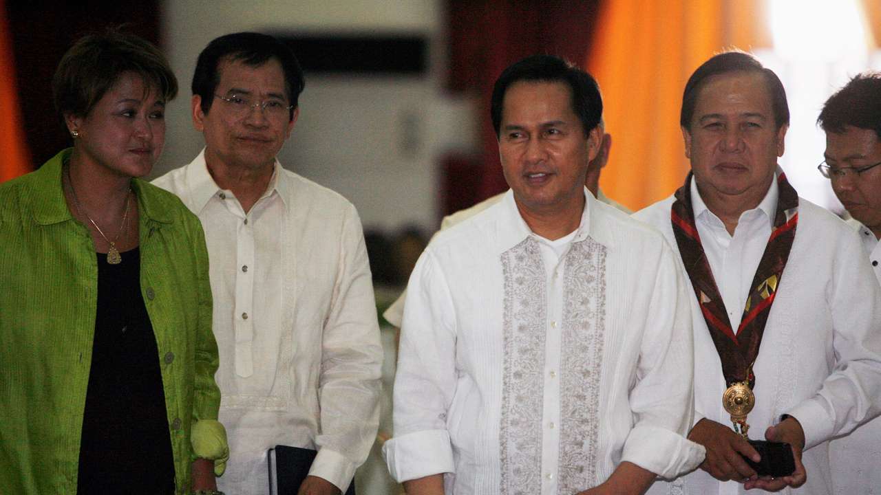 FILE PHOTO: International evangelist Pastor Apollo Quiboloy (2nd R) walks with presidential candidates attending his 60th birthday celebration in Davao City