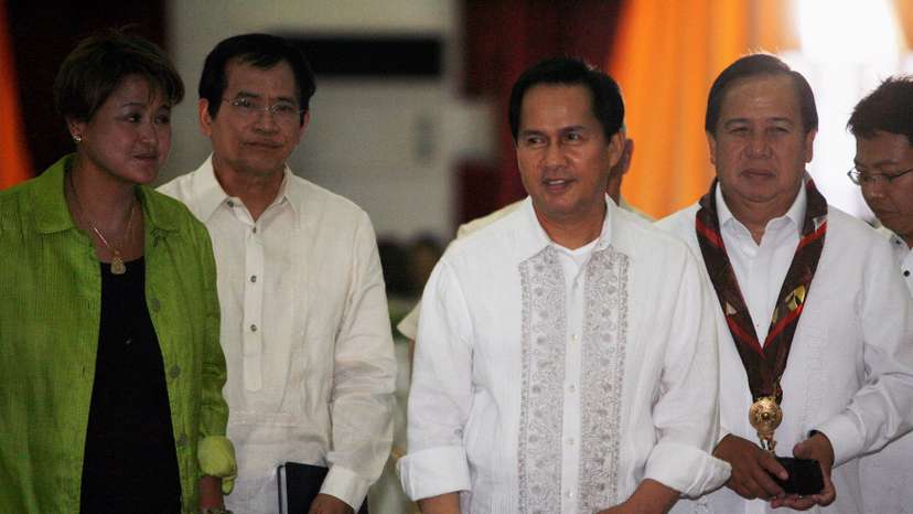 FILE PHOTO: International evangelist Pastor Apollo Quiboloy (2nd R) walks with presidential candidates attending his 60th birthday celebration in Davao City