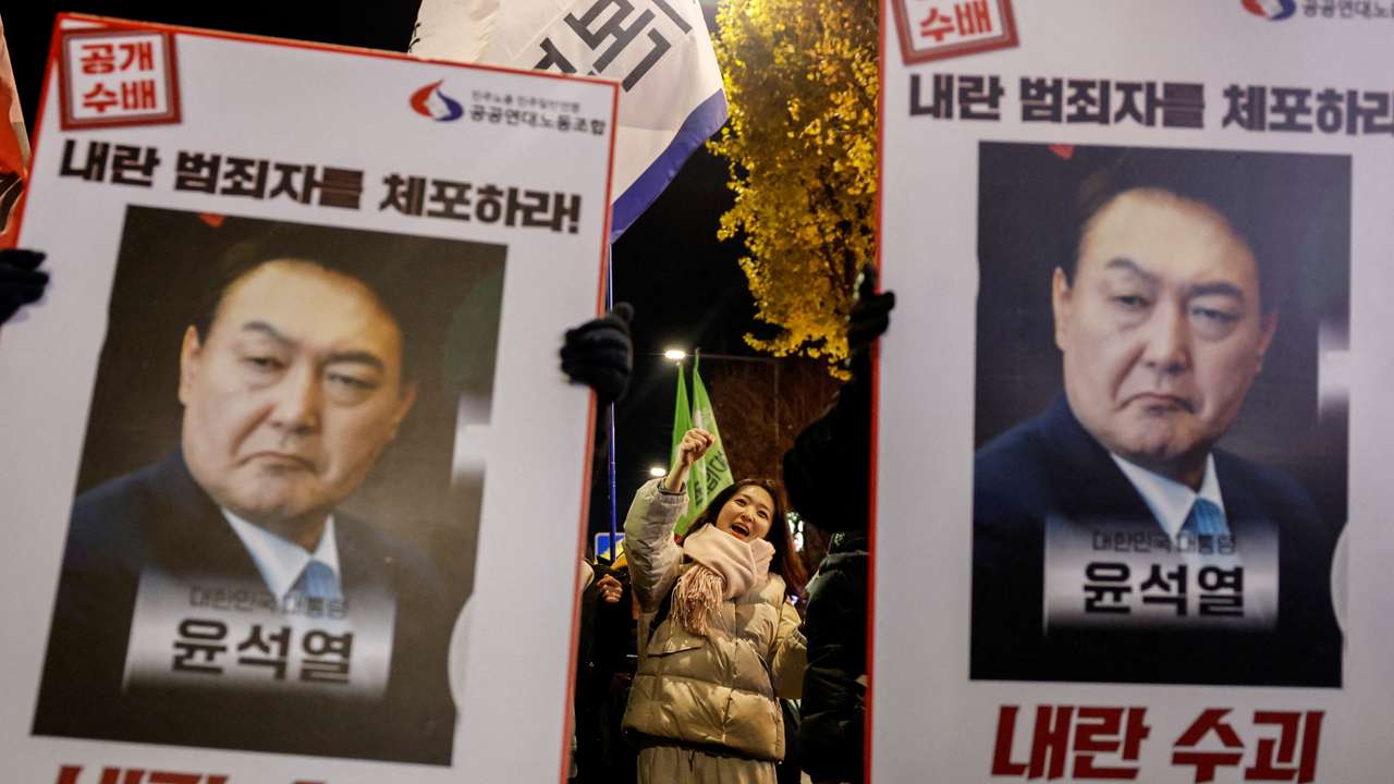 People protest during a candlelight vigil calling for the resignation of South Korean President Yoon Suk Yeol, in Seoul