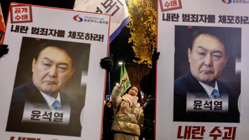 People protest during a candlelight vigil calling for the resignation of South Korean President Yoon Suk Yeol, in Seoul