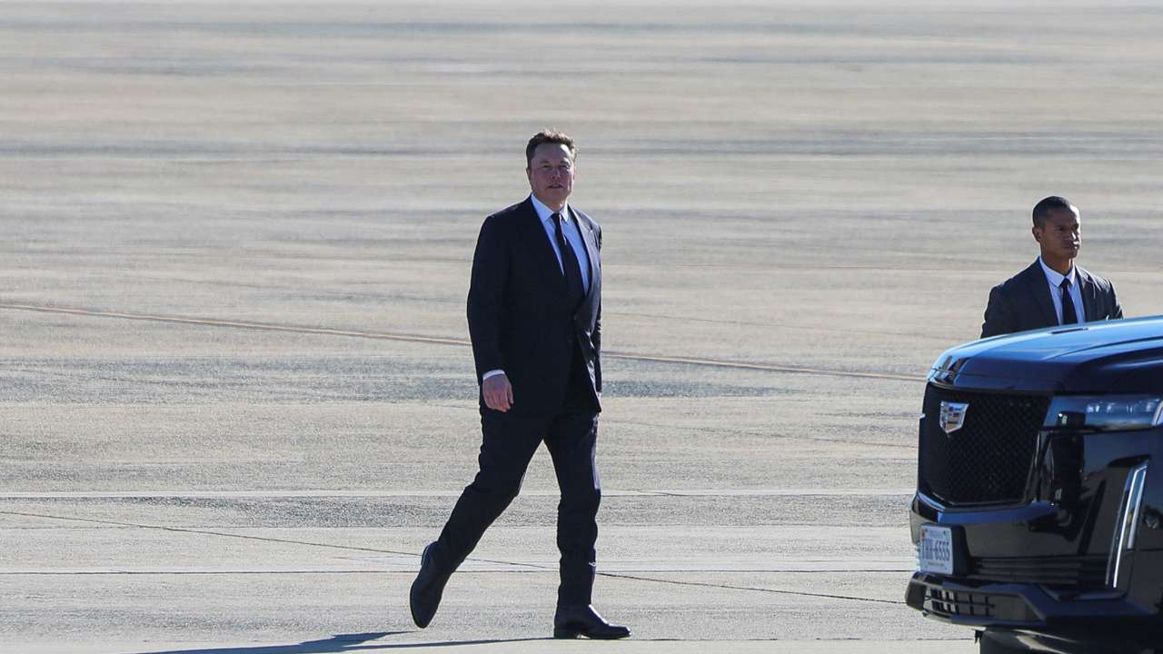 Tesla CEO and X owner Elon Musk walks on the tarmac at Joint Base Andrews