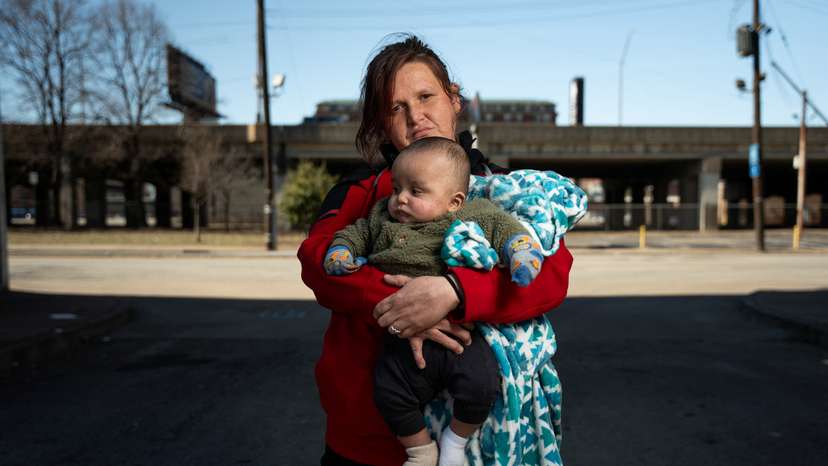 Samantha Crabtree poses for a portrait with her five-month-old son in Louisville