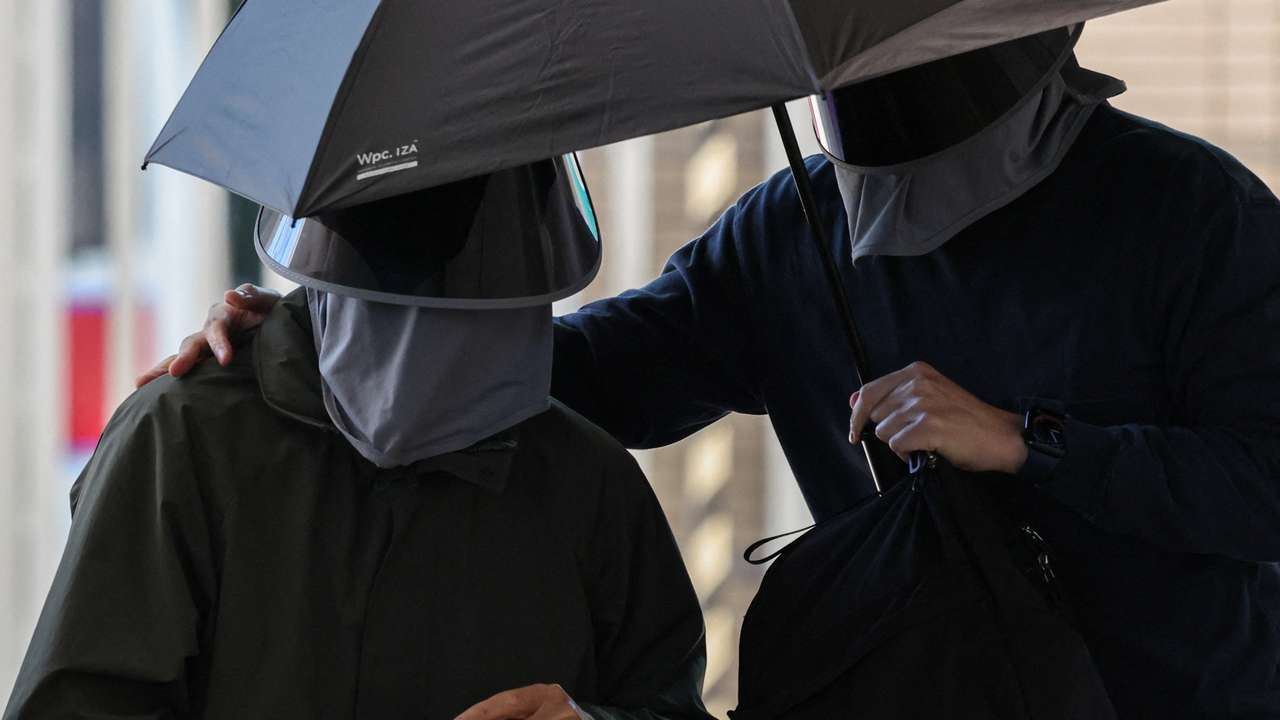 Kwok Yin-sang, father of wanted U.S.-based activist Anna Kwok, arrives at the West Kowloon Magistrates’ Courts building in Hong Kong