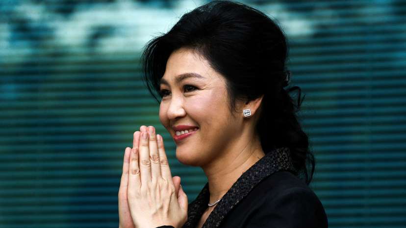 FILE PHOTO: Ousted former Thai prime minister Yingluck Shinawatra greets supporters as she arrives at the Supreme Court in Bangkok