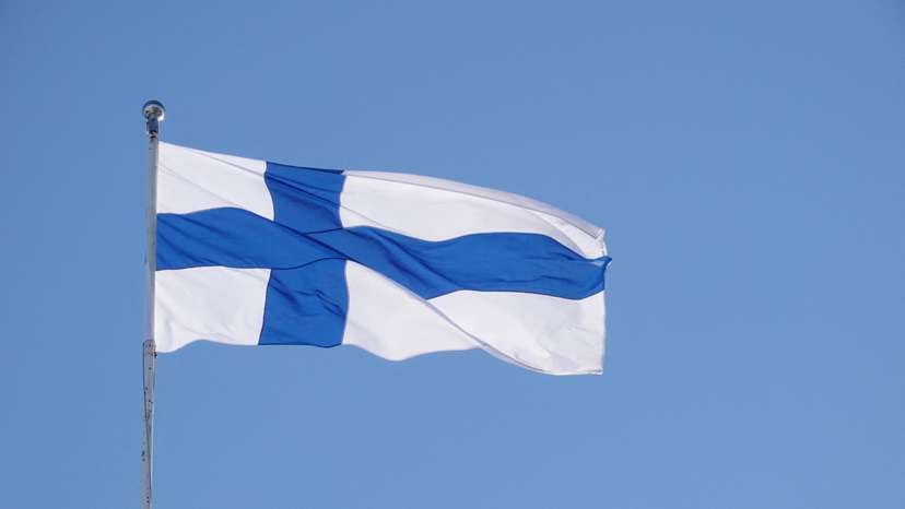 The Finnish flag flutters outside the city hall, as Finland becomes a member of NATO, in Helsinki