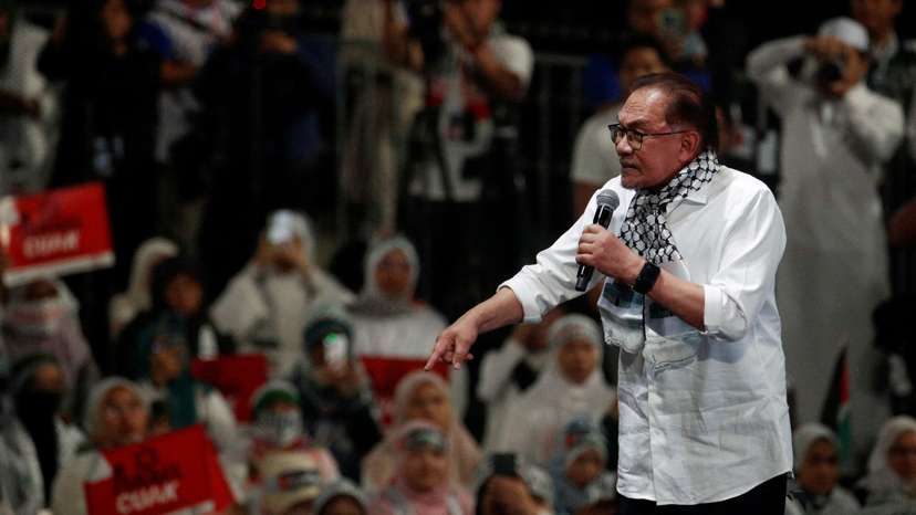 FILE PHOTO: Malaysia Prime Minister Anwar Ibrahim delivers his speech during a solidarity gathering to show support for Palestinians in Kuala Lumpur