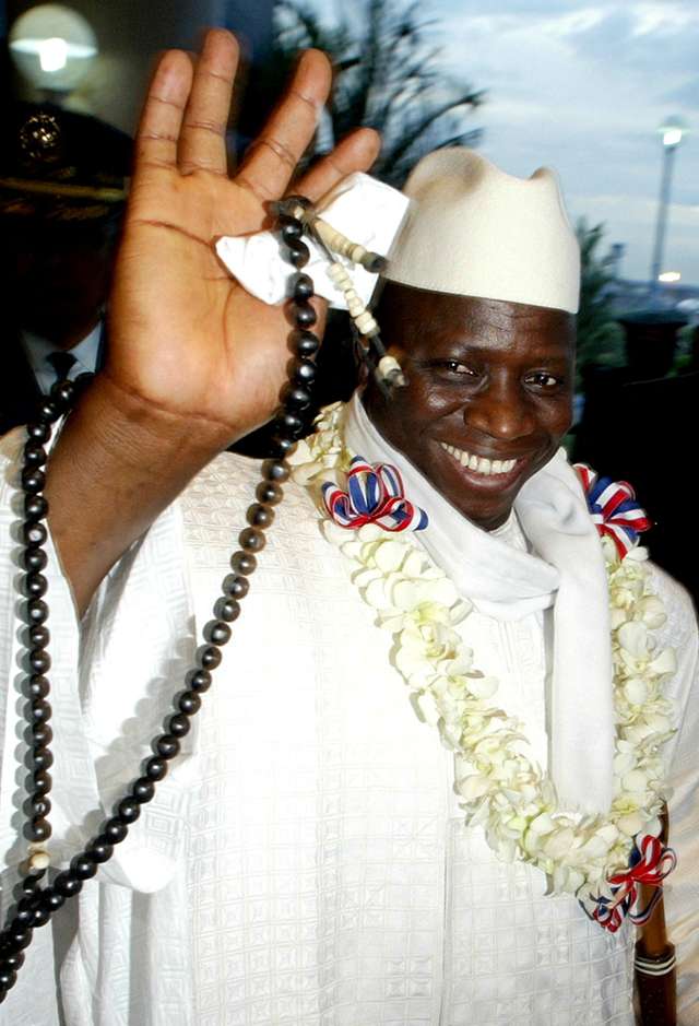 FILE PHOTO: Then Republic of Gambia President Yahya Jammeh waves during his arrival in Manila June 20, 2005. Jammeh was forced to flee his country in January 2017 after an election defeat. REUTERS/Cheryl Ravelo/File Photo