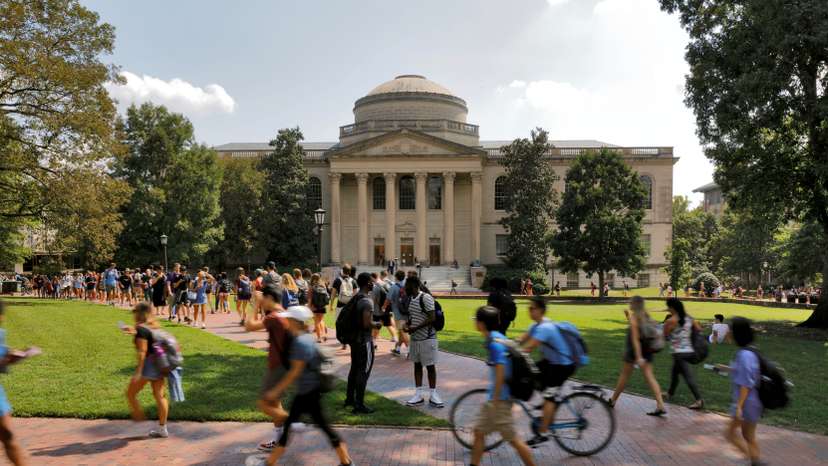 Students walk past Wilson Library on the campus of the University of North Carolina at Chapel Hill North Carolina